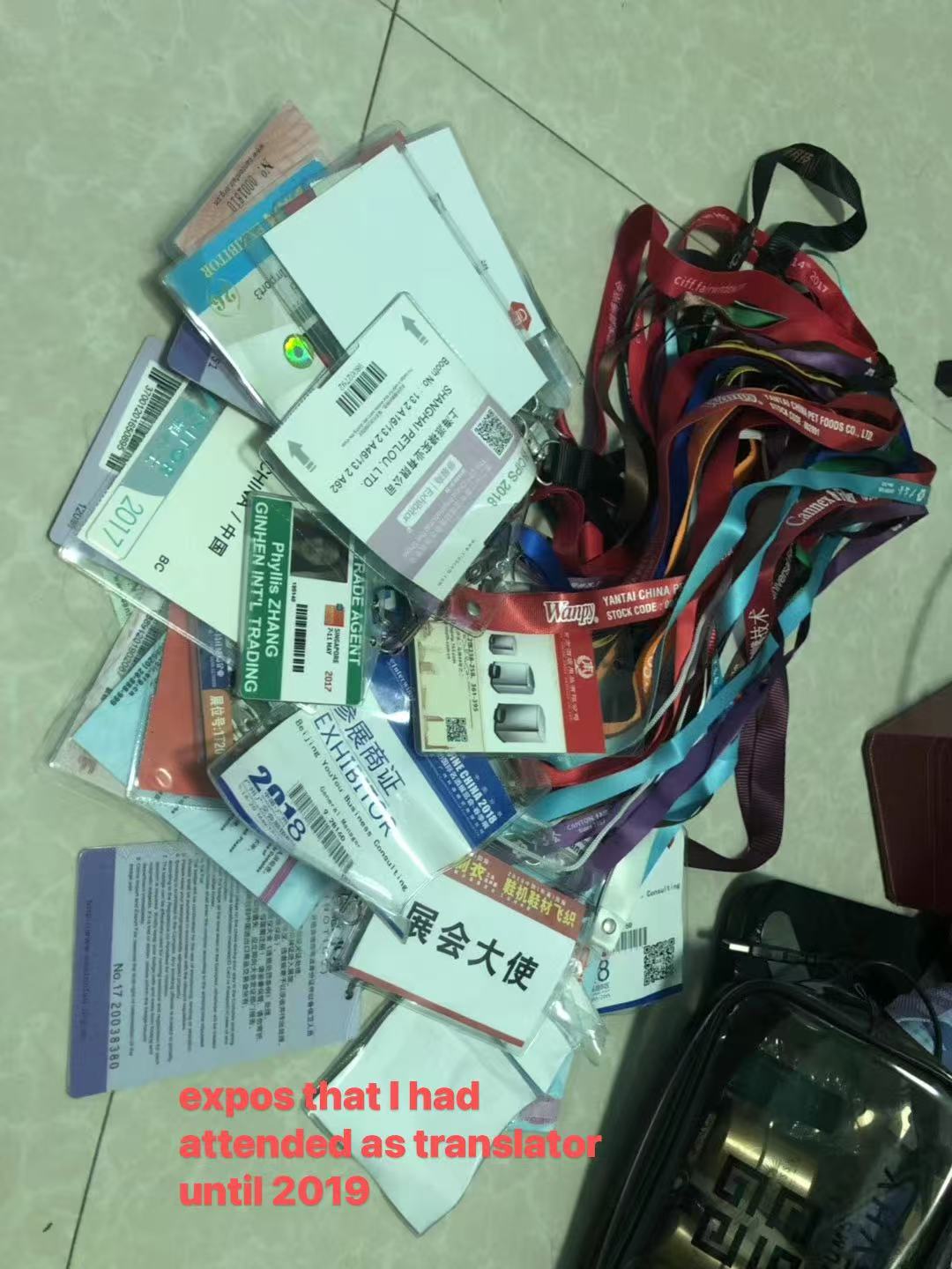 A pile of trade show exhibitor badges and lanyards collected by Cecilia Zhang